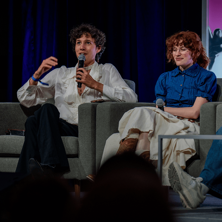 Creators and community members networking during a panel discussion